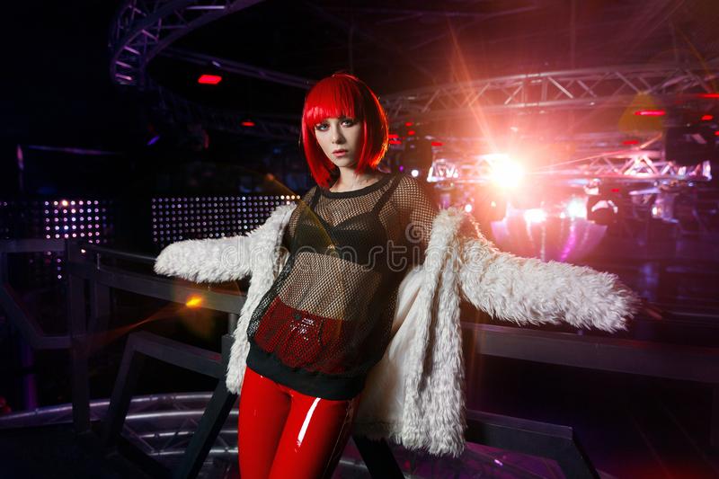 girl-red-hair-spotlights-night-club-transparent-blouse-nightclub-under-111976202.jpg